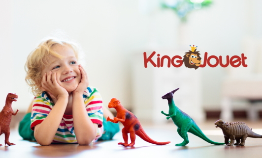 Child playing with toy dinosaurs from King Jouet
