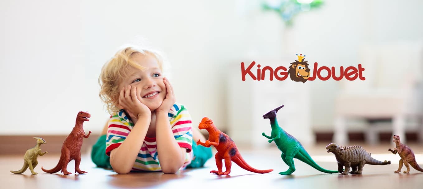 King Jouet - Child that is playing with rubber dinosaurs